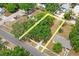 Property line highlighted in yellow in aerial view, showcasing a beautiful lot with mature trees and surrounding neighborhood at 5042 8Th St, Zephyrhills, FL 33542