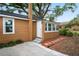 Cozy backyard featuring a back door with stairs, window, and minimal landscaping for easy maintenance at 5042 8Th St, Zephyrhills, FL 33542