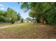 Large backyard with mature trees offers plenty of space and privacy at 5042 8Th St, Zephyrhills, FL 33542
