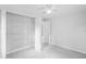 Bedroom with open closet at 5042 8Th St, Zephyrhills, FL 33542