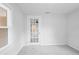 Bedroom with glass paned door at 5042 8Th St, Zephyrhills, FL 33542