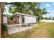 Covered parking spot includes a partially enclosed metal awning frame at 5042 8Th St, Zephyrhills, FL 33542