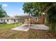 View of the covered carport area with metal awning frame in backyard at 5042 8Th St, Zephyrhills, FL 33542