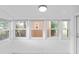Bright sunroom with a wall of windows providing natural light at 5042 8Th St, Zephyrhills, FL 33542