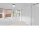 Sunroom with bright white walls and lots of windows at 5042 8Th St, Zephyrhills, FL 33542