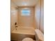 Bathroom featuring a shower-tub combination with a modern shower head and fixtures at 6046 7Th Ave, New Port Richey, FL 34653