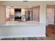 Modern kitchen with an island overlooking the dining area, stainless appliances, and ample storage space at 6046 7Th Ave, New Port Richey, FL 34653