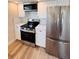 Renovated kitchen features new stainless steel appliances and sleek countertops, perfect for cooking at 6046 7Th Ave, New Port Richey, FL 34653