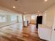 Modern kitchen with white cabinets, new appliances, and hardwood floors throughout the house at 6046 7Th Ave, New Port Richey, FL 34653