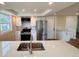 Modern kitchen with stainless steel appliances, ample counter space, and sleek white cabinetry at 6046 7Th Ave, New Port Richey, FL 34653