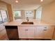 Beautiful kitchen island with stainless steel sink, dishwasher, and modern cabinetry at 6046 7Th Ave, New Port Richey, FL 34653