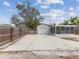 A paved driveway leads to a detached garage with a screen porch on the side of the home at 6436 2Nd S Ave, St Petersburg, FL 33707