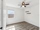 This bedroom is bright with natural light, wood floors, and floating shelves at 6436 2Nd S Ave, St Petersburg, FL 33707