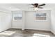 Bedroom featuring wood-look floors, a ceiling fan, natural light, and a double closet at 6436 2Nd S Ave, St Petersburg, FL 33707