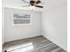 Cozy bedroom with wood-look flooring and natural light at 6436 2Nd S Ave, St Petersburg, FL 33707