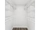 Walk-in closet with ample shelving and wood-look flooring at 6436 2Nd S Ave, St Petersburg, FL 33707