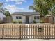 Charming single-story home featuring a well-maintained front yard and classic picket fence at 6436 2Nd S Ave, St Petersburg, FL 33707