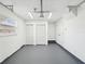 This garage has plenty of storage space, painted floor, and fluorescent lighting at 6436 2Nd S Ave, St Petersburg, FL 33707