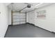 The garage has ample space, an automatic door, and a side entry door at 6436 2Nd S Ave, St Petersburg, FL 33707