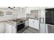 Contemporary kitchen featuring granite counters, stainless steel appliances, and pendant lighting at 6436 2Nd S Ave, St Petersburg, FL 33707