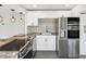 Modern kitchen with granite countertops, stainless steel appliances, and a stylish backsplash at 6436 2Nd S Ave, St Petersburg, FL 33707