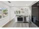 Contemporary kitchen with granite counters, modern appliances, and seamless open living space at 6436 2Nd S Ave, St Petersburg, FL 33707