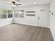 Bright living area features new flooring, lots of light, and an inviting front door at 6436 2Nd S Ave, St Petersburg, FL 33707