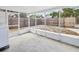 The screen porch offers a cozy space to enjoy the outdoors with a backyard view and concrete flooring at 6436 2Nd S Ave, St Petersburg, FL 33707