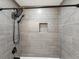 Contemporary shower with gray tiled walls, a rainfall shower head, and a built-in niche at 6436 2Nd S Ave, St Petersburg, FL 33707