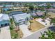 Beautiful home exterior with a long driveway, lush tropical landscaping, and a well manicured lawn at 743 Kingston Ct, Apollo Beach, FL 33572