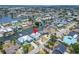 An aerial view highlighting a waterfront property amidst canals, palm trees, and well-maintained lawns at 743 Kingston Ct, Apollo Beach, FL 33572