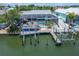 Relaxing screened-in pool and dock with a boat lift offers beautiful outdoor space for enjoying the waterfront at 743 Kingston Ct, Apollo Beach, FL 33572