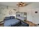 Bright bedroom features bunk beds, a unique ceiling fan, and a nautical-themed design at 743 Kingston Ct, Apollo Beach, FL 33572