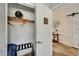 Functional closet with shelving, hanging rods, and easy access to the main living area at 743 Kingston Ct, Apollo Beach, FL 33572