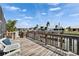 Waterfront deck with wood railings and views of boatlifts and canal at 743 Kingston Ct, Apollo Beach, FL 33572