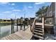Beautiful dock and boat lift offering convenient waterfront access and peaceful views at 743 Kingston Ct, Apollo Beach, FL 33572