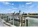 Private dock featuring a boat lift on a tranquil waterfront canal at 743 Kingston Ct, Apollo Beach, FL 33572