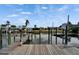 Waterfront dock with boat lifts provides direct access to serene canals and waterways at 743 Kingston Ct, Apollo Beach, FL 33572