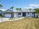 Single-story home with a stone facade garage, xeriscaping, and a walkway to the front door at 743 Kingston Ct, Apollo Beach, FL 33572