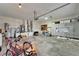 Spacious garage featuring overhead lighting and storage space, and visible utilities at 743 Kingston Ct, Apollo Beach, FL 33572