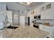 Modern kitchen showcasing stainless steel appliances, granite counters, and ample cabinet space at 743 Kingston Ct, Apollo Beach, FL 33572