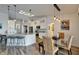 Bright kitchen with island, pendant lighting, and stainless appliances is perfect for entertaining at 743 Kingston Ct, Apollo Beach, FL 33572