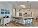 Modern kitchen with breakfast bar, granite countertops, and stainless steel appliances at 743 Kingston Ct, Apollo Beach, FL 33572