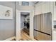 Convenient laundry area featuring modern appliances and built-in shelving at 743 Kingston Ct, Apollo Beach, FL 33572