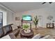Comfortable living room showcasing a leather sectional, stylish decor, and lots of natural light at 743 Kingston Ct, Apollo Beach, FL 33572