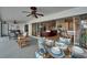 This home features a screened patio with a dining table and view of the living room and kitchen at 743 Kingston Ct, Apollo Beach, FL 33572