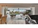 This home features an amazing outdoor space with an in-ground pool, a tiki bar, and water views at 743 Kingston Ct, Apollo Beach, FL 33572
