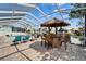 Outdoor fun awaits with a tiki bar by the pool, perfect for enjoying refreshments by the water at 743 Kingston Ct, Apollo Beach, FL 33572