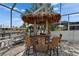 This fun tiki bar is perfect for poolside entertaining and gatherings in a tropical backyard oasis at 743 Kingston Ct, Apollo Beach, FL 33572