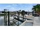 Picture of waterfront dock with a pelican and a boat lift on a canal at 743 Kingston Ct, Apollo Beach, FL 33572
